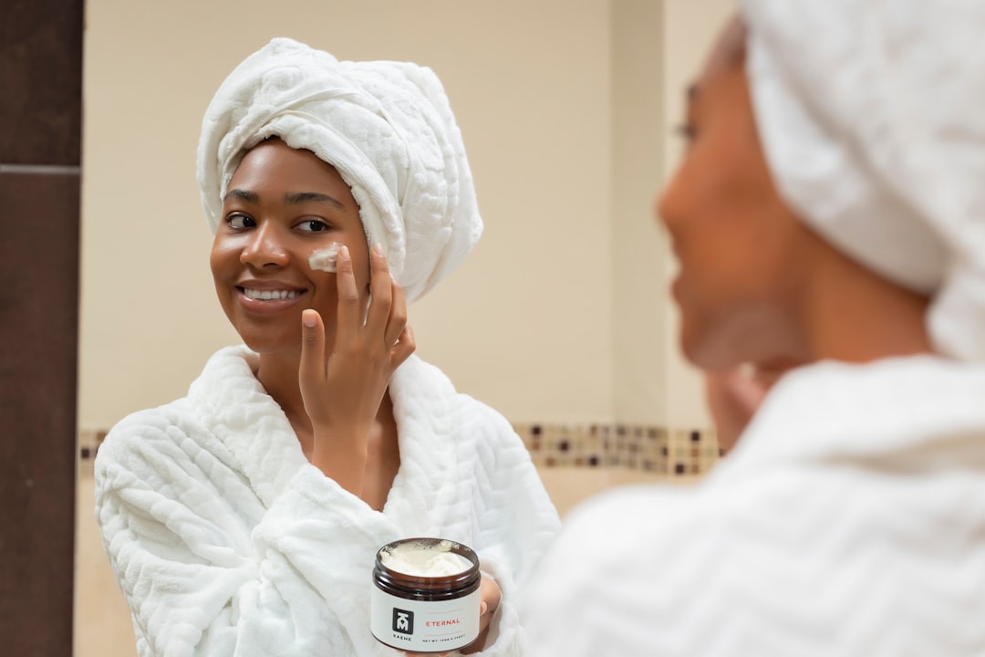 A serene morning scene featuring skincare products on a bathroom counter with natural light streaming in.