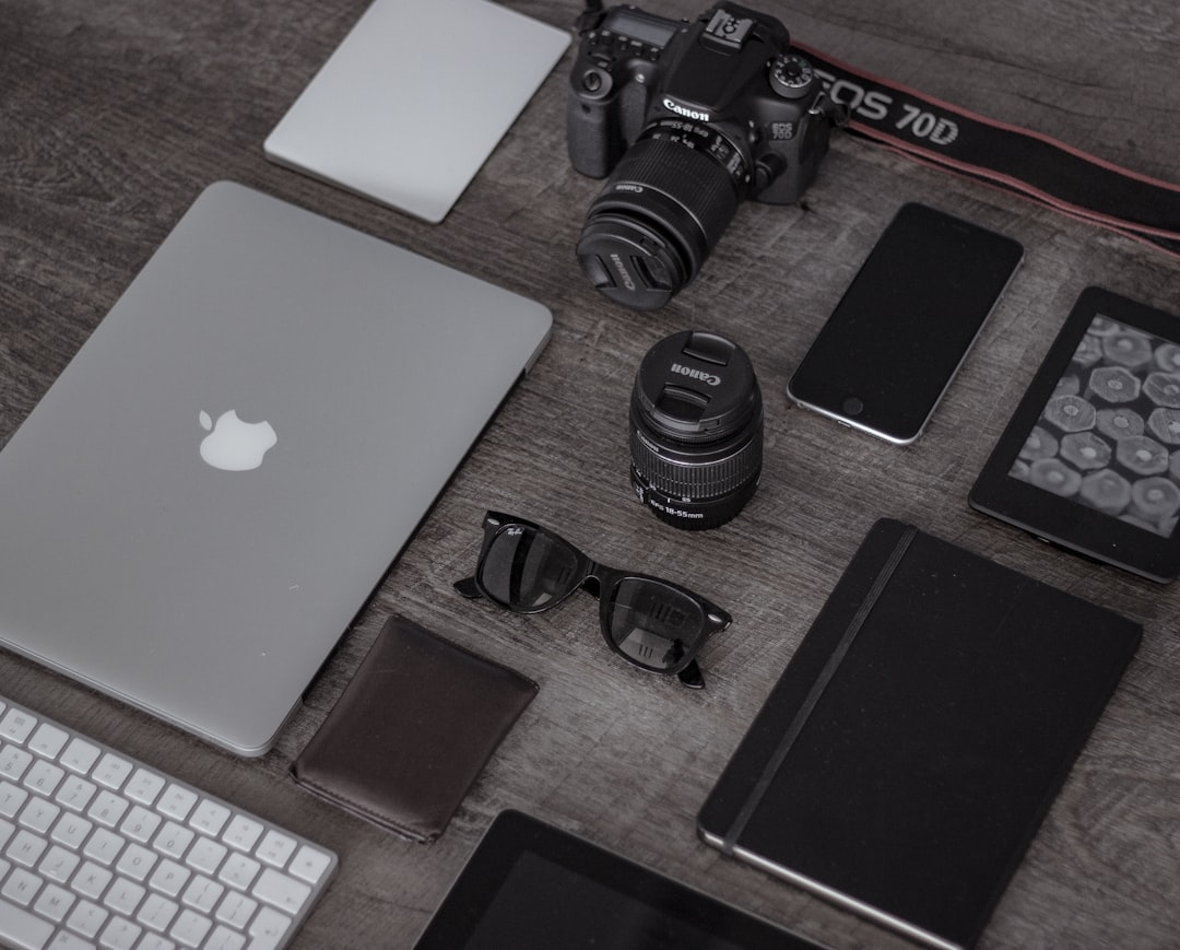 A collection of modern tech gadgets on a desk, including a smart speaker, wireless charger, and a digital assistant device, showcasing convenience in everyday life.